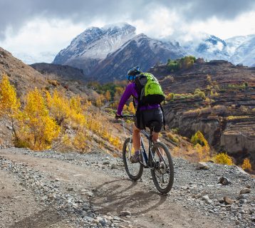 Biker-girl in Himalaya mountains, Anapurna region