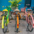 A,Row,Of,Vintage,Bicycles,Painted,Bright,Colors,,Parked,On